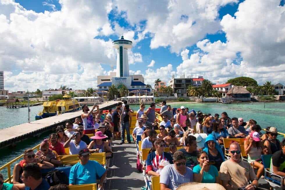 Travelers on a waterfront excursion in the Cancun region for Resort Concierge Escapes editorial content.